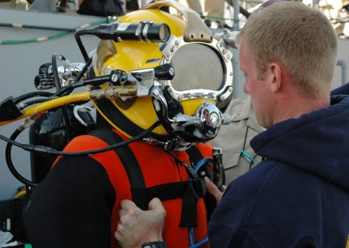 US Navy 060411-N-6764G-115 Sonar Technician Surface 3rd Class Ryan Travis is suited for his Master Diver qualification pre-screening exercise aboard Landing Craft Unit (LCU-1647) at Naval Amphibious Base Little Creek
