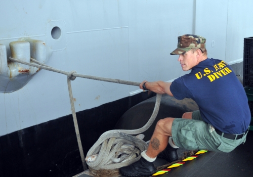 US Navy 111018-N-UD469-023 Navy Diver 1st Class Brody Kraft, assigned to Southwest Region Maintenance Center at Naval Air Station North Island, pul