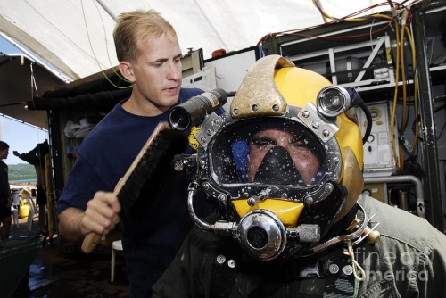 us-navy-diver-performs-a-leak-check-stocktrek-images
